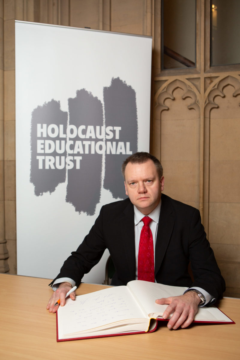 Nick Thomas-Symonds MP signing the Holocaust Educational Trust Book of Commitment