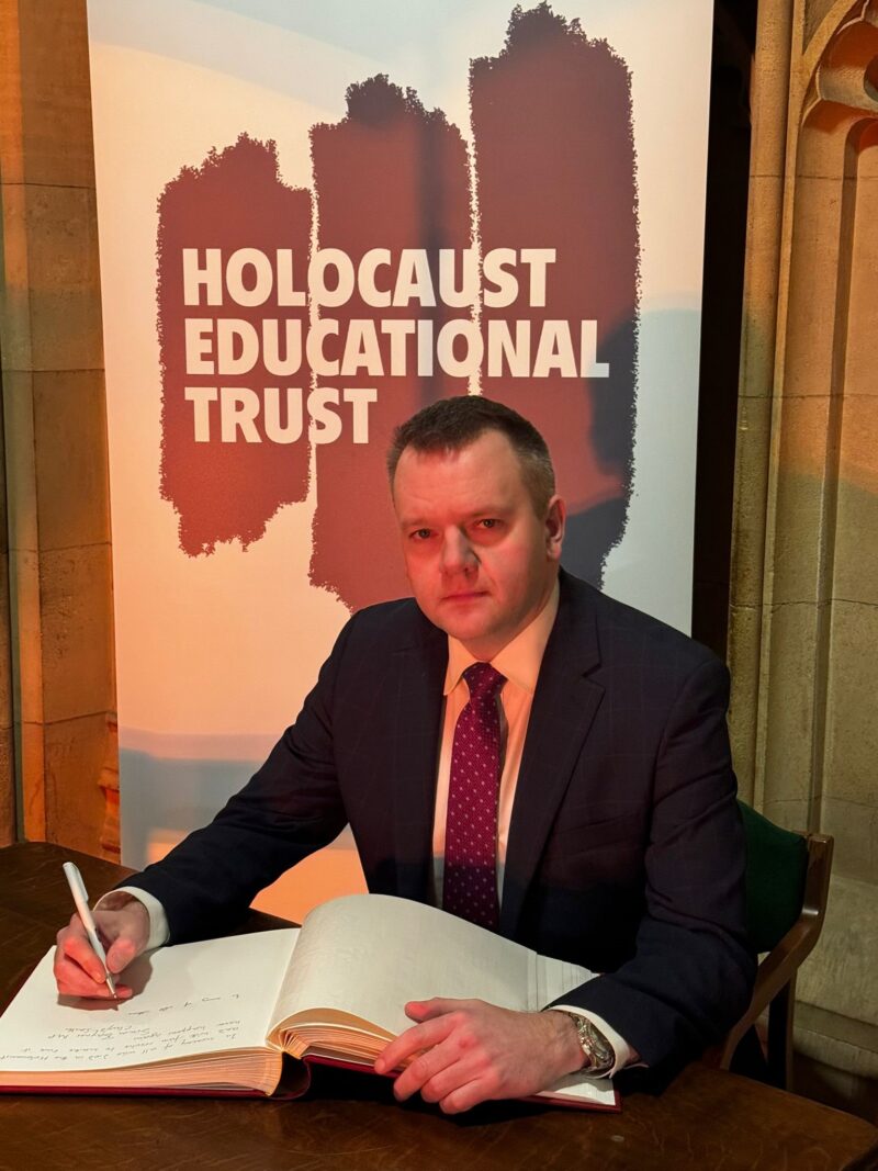 Nick Thomas-Symonds signing the Book of Commitment to mark Holocaust Memorial Day 2024